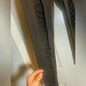 Ripped black leggings by Bizzolo. Women’s size large